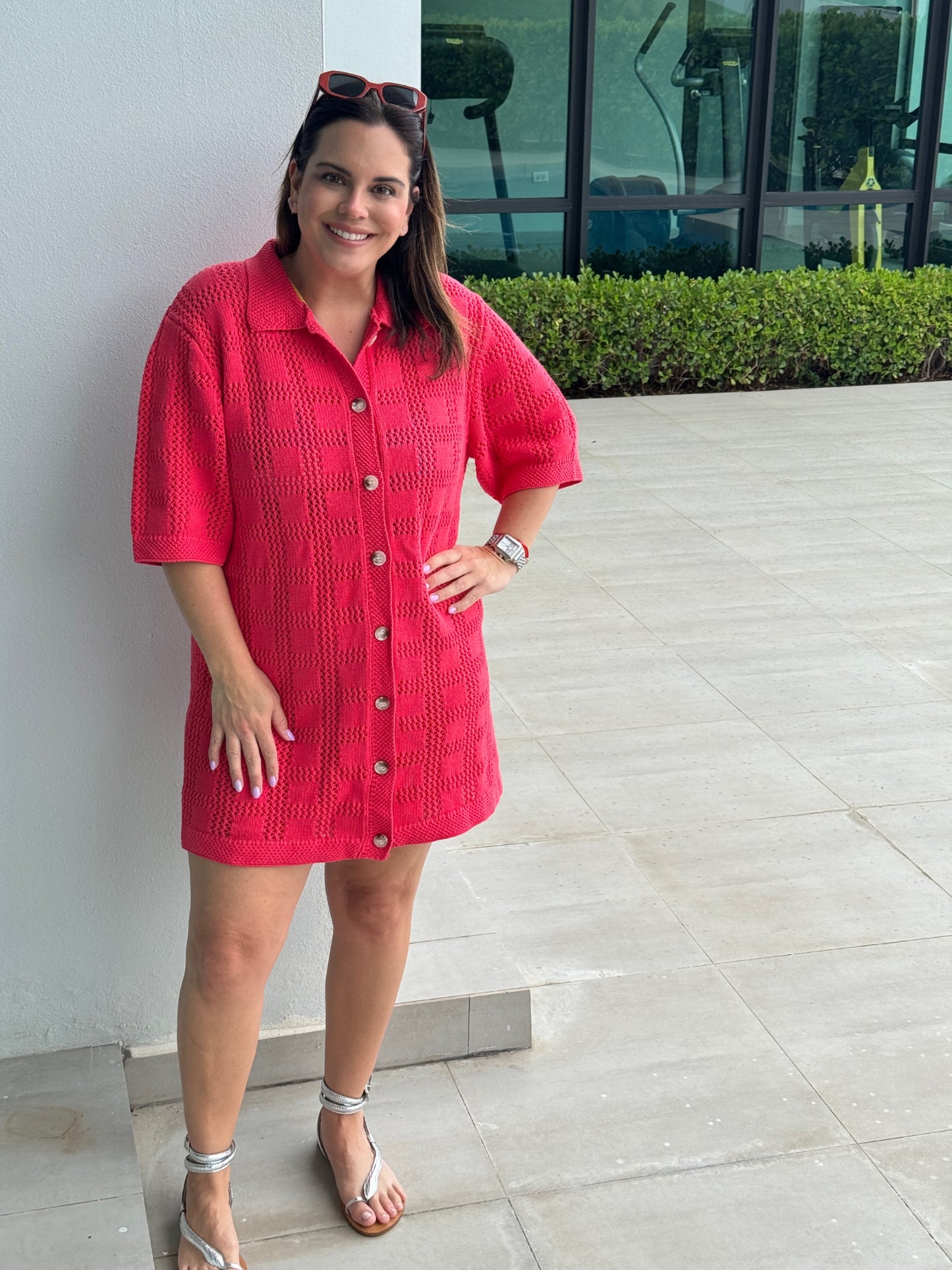 A woman with a bright pink Crochet Pattern dress