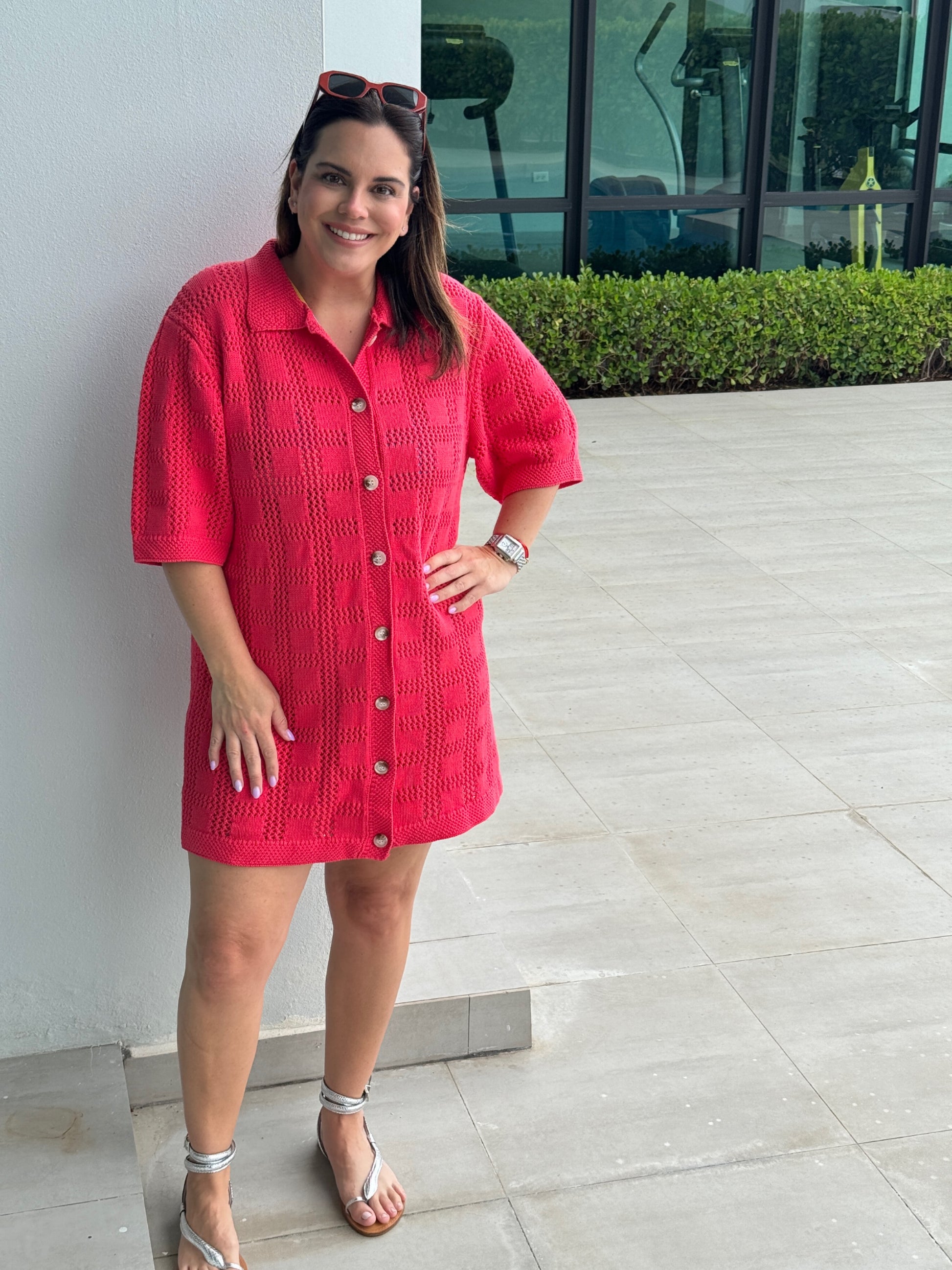 A woman with a bright pink Crochet Pattern dress