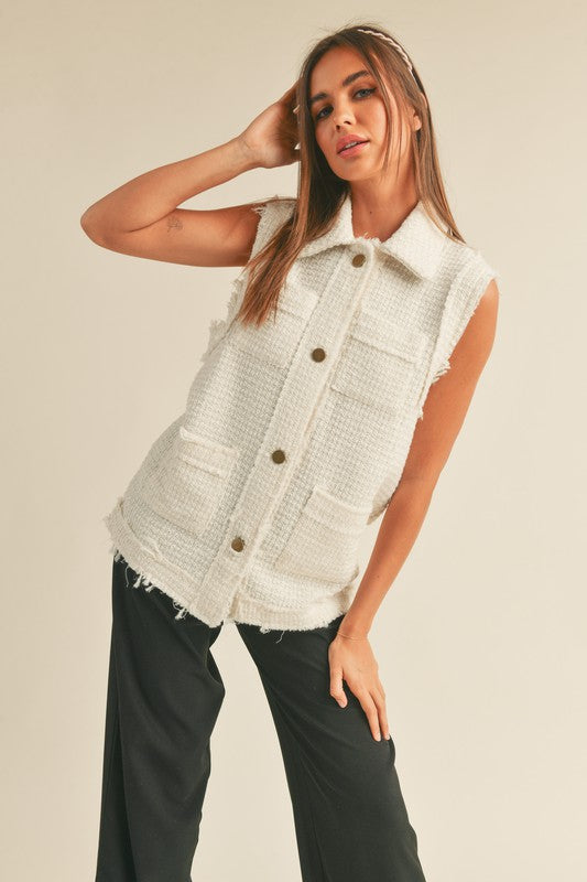 A ladies cream button downed vest.