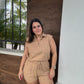 A brown half-zip neck sleeveless knit romper. 