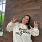 A ladies cream sweatshirt that says good vibes only.